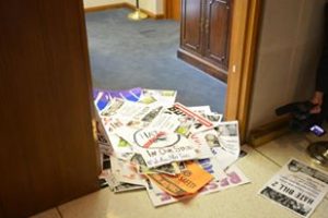 Anti-HB2 signs left in the doorway of NC Senate leader Phil Berger